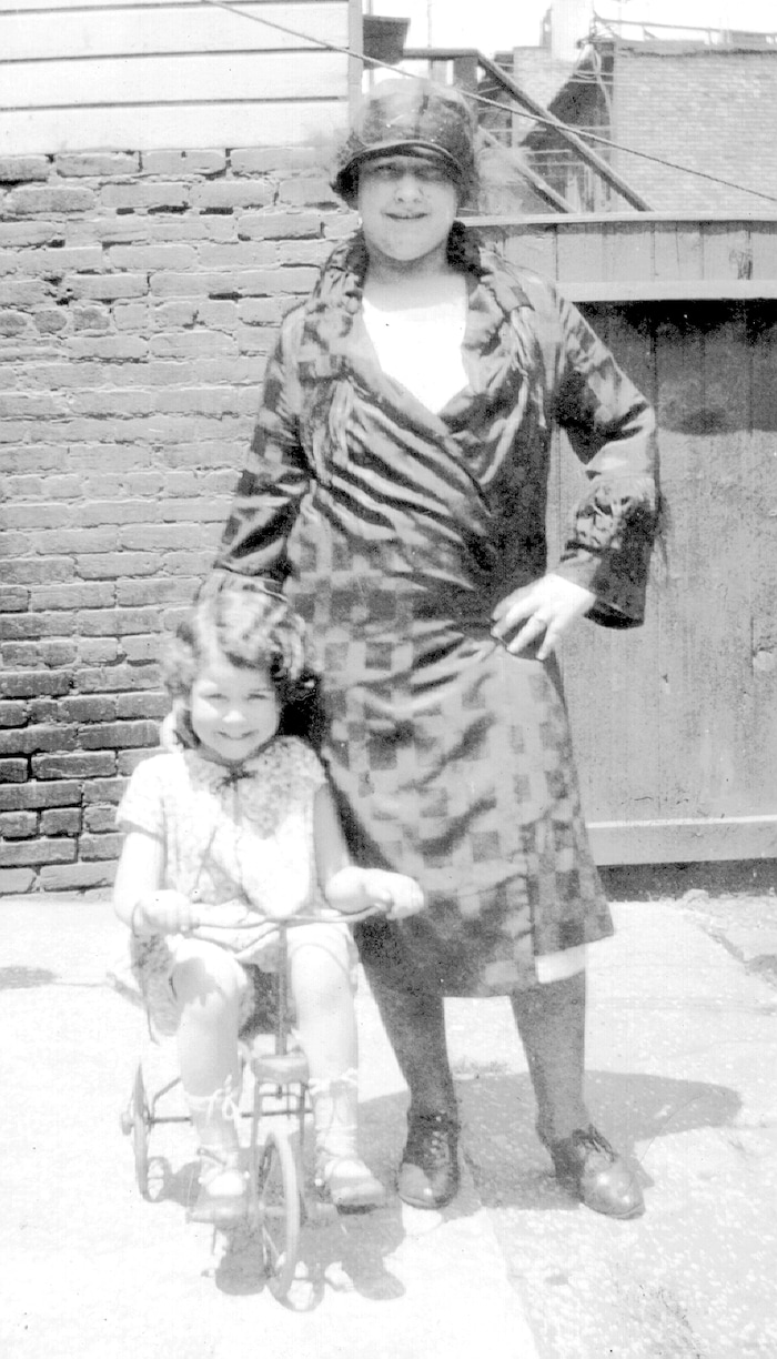 (Photo courtesy of Harold Carr) Audrey B. Carr, on tricycle, with her mother, Hortense Deane.