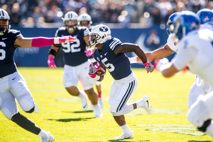 (Chris Detrick  |  The Salt Lake Tribune)  Brigham Young Cougars running back Ula Tolutau (5) runs the ball during the game at LaVell Edwards Stadium Saturday, October 28, 2017.  