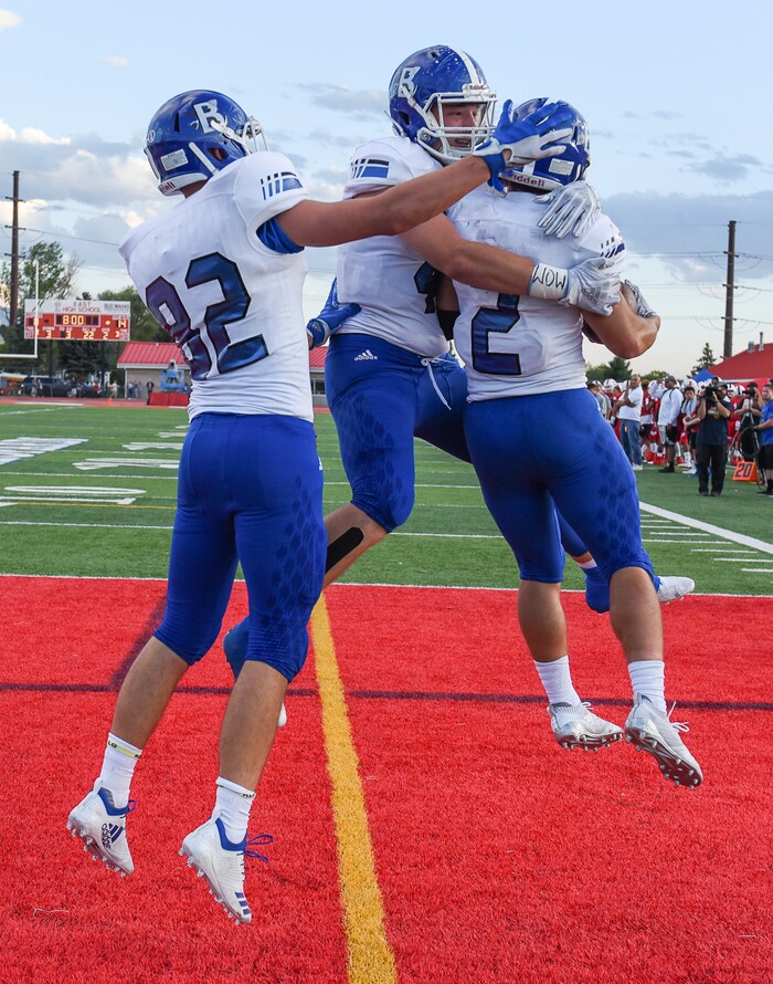 (Francisco Kjolseth  |  The Salt Lake Tribune)  Bingham's Andrew Wimmer celebrates with teammates after scoring their team's third touchdown against East in the second quarter of their game at East on Friday, Aug. 24, 2018.