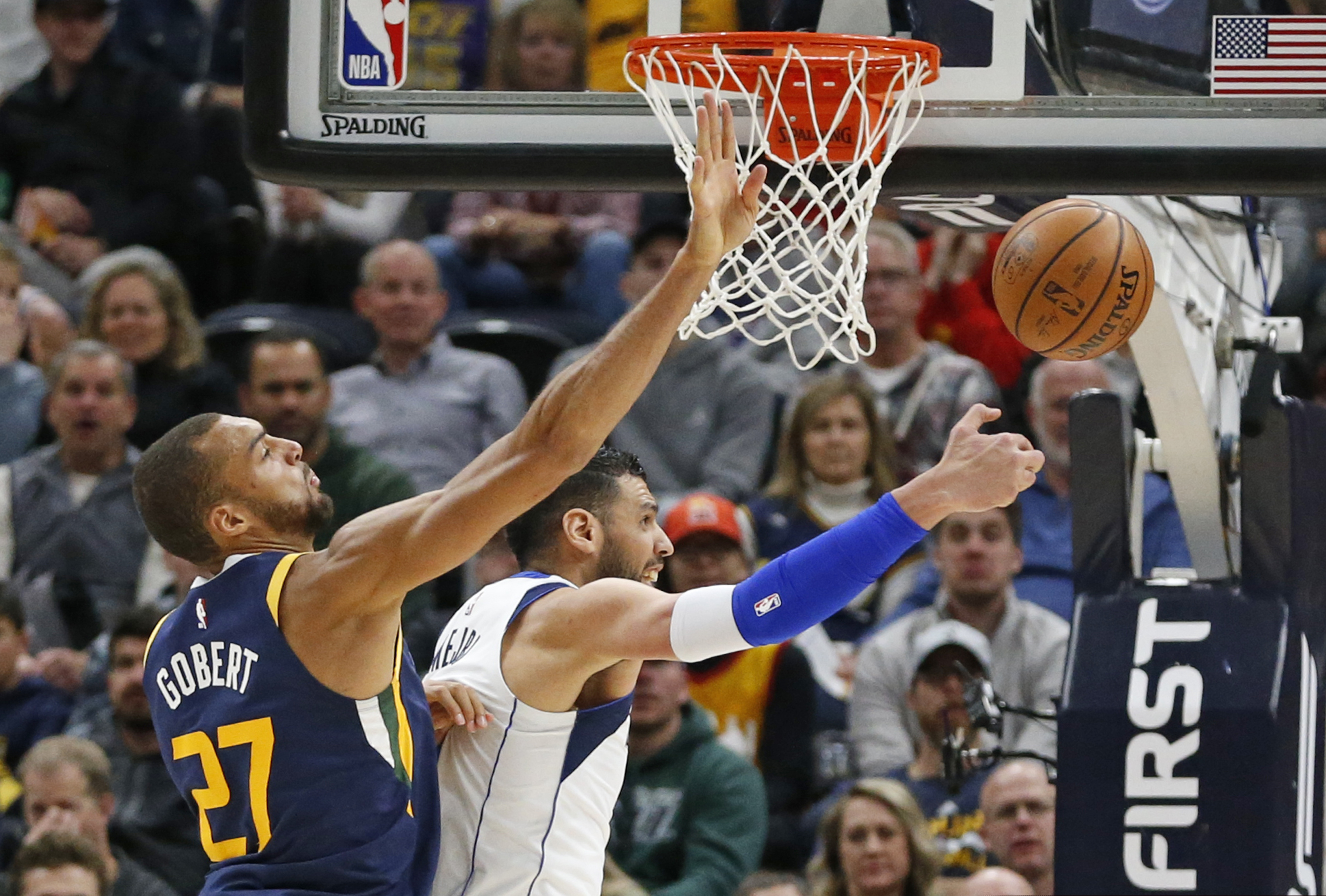 Utah Jazz center Rudy Gobert (27) defends against Dallas Mavericks center Salah Mejri, right, during the first half of an NBA basketball game Saturday, Feb. 23, 2019, in Salt Lake City. (AP Photo/Rick Bowmer)