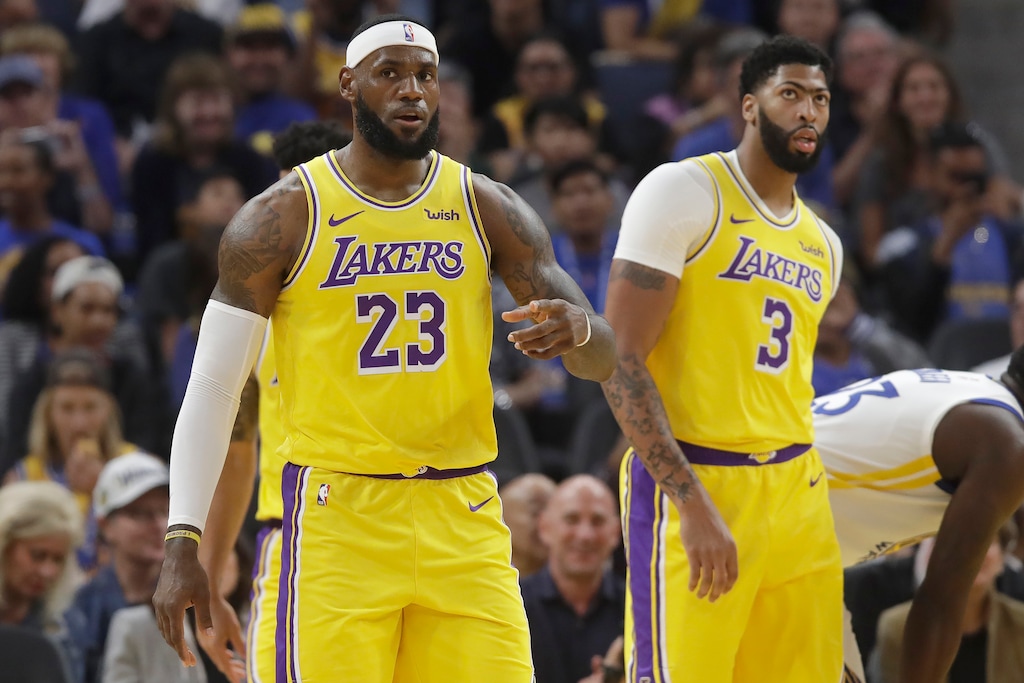 (Jeff Chiu | AP) Los Angeles Lakers forward LeBron James (23) reacts in front of forward Anthony Davis (3) during the first half of a preseason NBA basketball game against the Golden State Warriors in San Francisco, Saturday, Oct. 5, 2019.