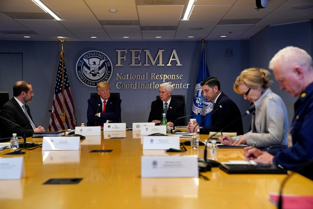 (Evan Vucci | AP file photo) In this March 19 photo, President Donald Trump attends a teleconference with governors at the Federal Emergency Management Agency headquarts in Washington. From left, Department of Health and Human Services Secretary Alex Azar, Trump, Vice President Mike Pence, Acting Secretary of Homeland Security Chad Wolf, White House coronavirus response coordinator Dr. Deborah Birx and Adm. Brett Giroir, assistant secretary for health. There’s the standard process for getting urgently needed coronavirus equipment: send a request to FEMA. Then there’s the other way: have a buddy who can pick up the phone and call the Trump White House. Trump’s team has proudly recounted instances where a call to the White House has produced fast results for those who have an in with the president.