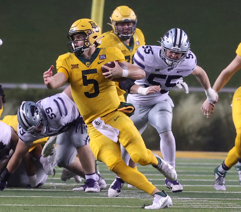 Baylor quarterback Charlie Brewer (5) out runs the Kansas State defense for a first down in the first half of an NCAA college football game, Saturday, Nov. 28, 2020, in Waco, Texas. (Jerry Larson/Waco Tribune-Herald via AP)