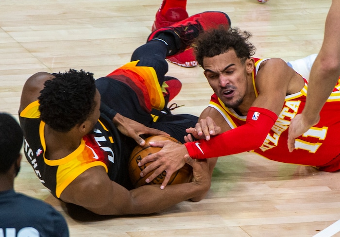 (Rick Egan | The Salt Lake Tribune) Atlanta Hawks guard Trae Young (11) goes for a loose ball along with Utah Jazz guard Donovan Mitchell (45), in NBA action between the Utah Jazz and the Atlanta Hawks at Vivint Arena, on Friday, Jan. 15, 2021.