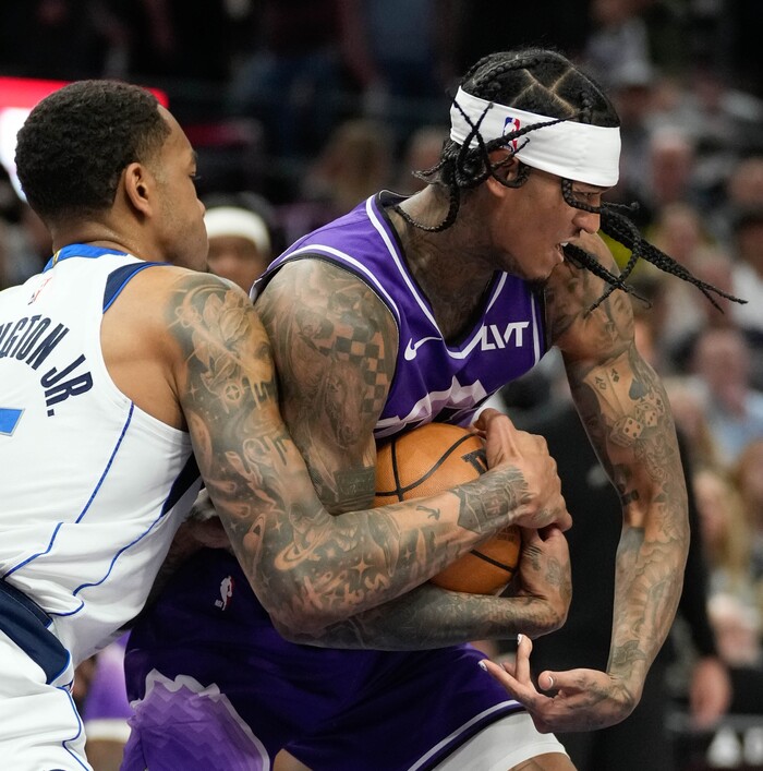(Francisco Kjolseth  |  The Salt Lake Tribune) Utah Jazz guard Jordan Clarkson (00) muscles Dallas Mavericks forward P.J. Washington (25) for the ball during an NBA basketball game Monday, March 25, 2024, in Salt Lake City.
