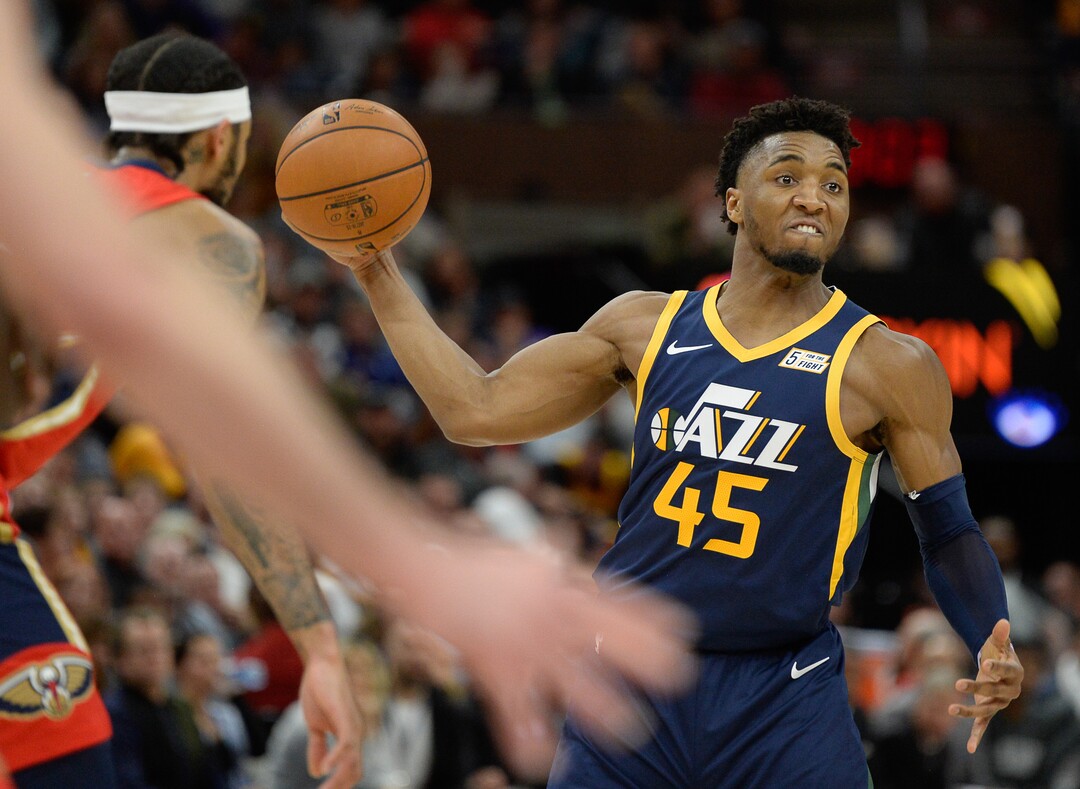 (Francisco Kjolseth  |  The Salt Lake Tribune)  Utah Jazz guard Donovan Mitchell (45) passes the ball to a teammate as the Utah Jazz host the New Orleans Pelicans in their NBA basketball game at Vivint Smart Home Arena in Salt Lake City on Sat. Nov. 23, 2019.