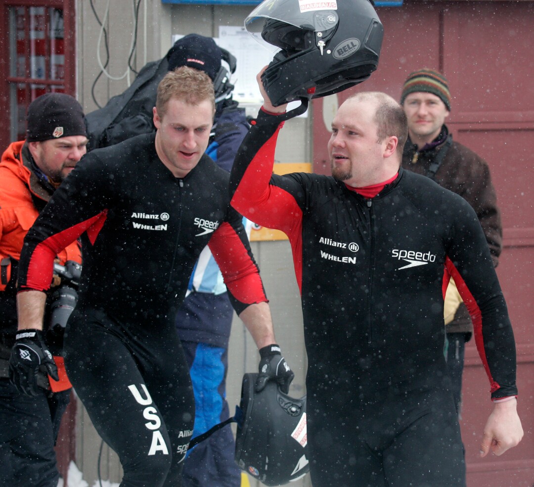American driver Steven Holcomb, right, and brakeman Curtis Tomasevicz celebrate their third place finish in the two-man Bobsled World Championships in Lake Placid, N.Y., Sunday, Feb. 22, 2009.  (AP Photo/Mike Groll)