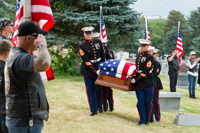 (Alex Gallivan  |  Special to The Tribune) Marine Pfc. Robert K. Holmes, who died 77 years ago aboard the USS Oklahoma during the attack on Pearl Harbor, is laid to rest in the Salt Lake City Cemetery, Monday, Aug. 20, 2018.