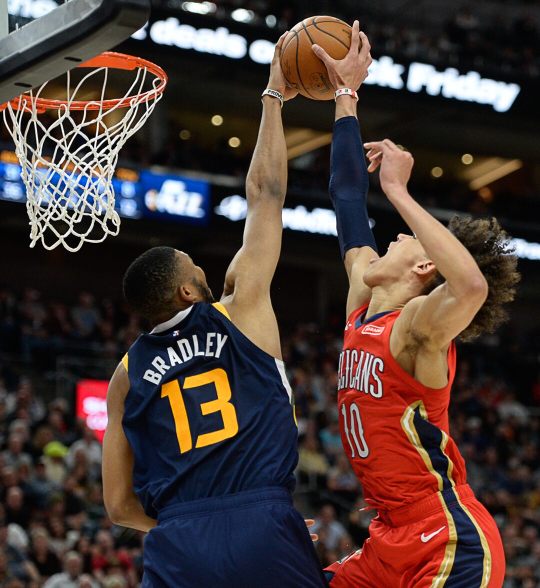 (Francisco Kjolseth  |  The Salt Lake Tribune)  Utah Jazz center Tony Bradley (13) moves in for the monster block on New Orleans Pelicans center Jaxson Hayes (10) as the Utah Jazz host the New Orleans Pelicans in their NBA basketball game at Vivint Smart Home Arena in Salt Lake City on Sat. Nov. 23, 2019.