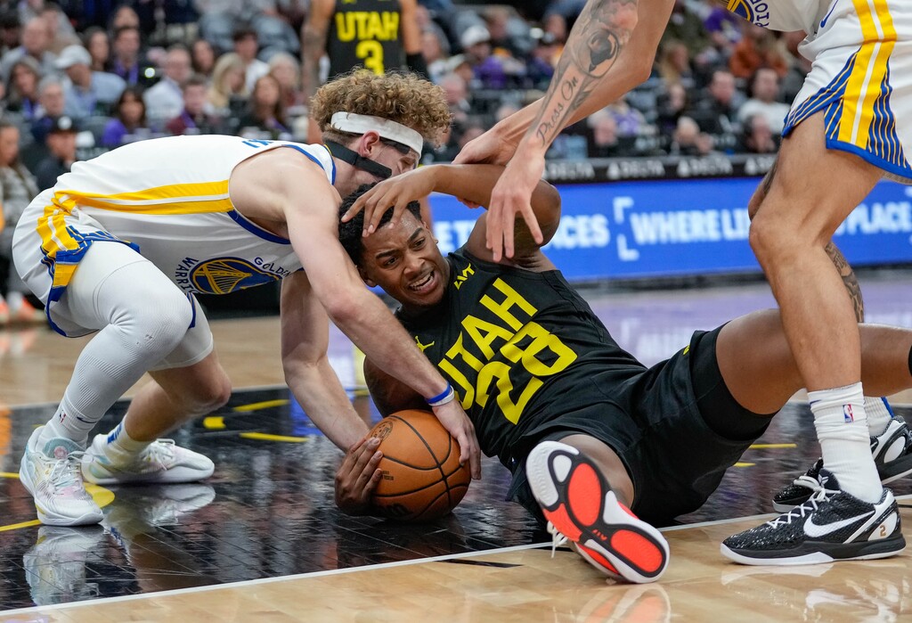 (Francisco Kjolseth  | The Salt Lake Tribune) Utah Jazz forward Brice Sensabaugh (28) gets roughed up on the floor by the Golden State Warriors during an NBA basketball game, Friday, Oct. 25, 2024, in Salt Lake City.