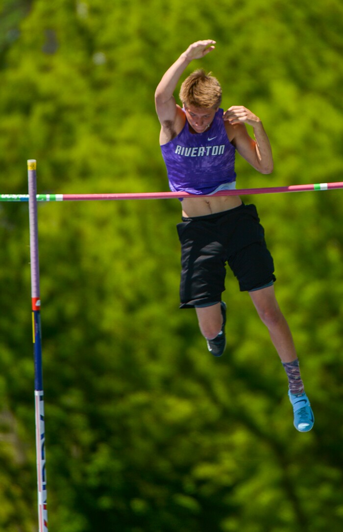 (Leah Hogsten | The Salt Lake Tribune) Not even his shirt can stop Riverton's Trenton James from taking 1st in the 6A Boys' Pole Vault finals with a height of 15' at the 2018 Utah UHSAA State Track and Field Championships at Clarence Robison Track on the campus of Brigham Young University in Provo, Thursday, May 17, 2018.