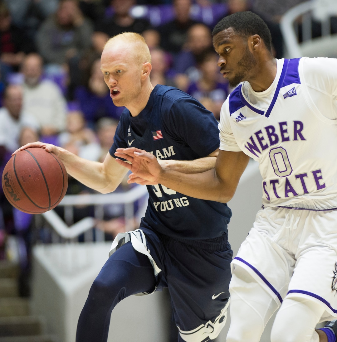 (Rick Egan  |  The Salt Lake Tribune)       Brigham Young Cougars guard TJ Haws (30) leads a fast break, as Weber State Wildcats guard Caleb Nero (0) defends, in basketball action between Brigham Young Cougars and Weber State Wildcats, at the Dee Event Center in Ogden, Saturday, Dec. 1, 2018.