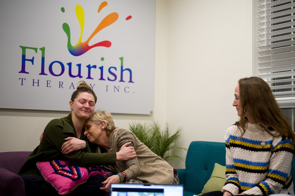 (Trent Nelson  |  The Salt Lake Tribune) Sami Simpson and Lisa Hansen console each other while discussing the effect of anti-LGBTQ legislation on patients, in Orem on Monday, Feb. 12, 2024.