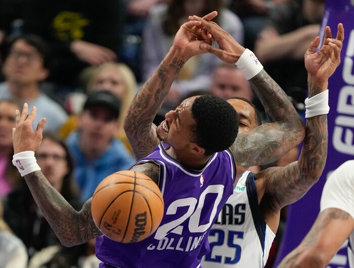 (Francisco Kjolseth  |  The Salt Lake Tribune) Utah Jazz forward John Collins (20) gets the ball knocked away by Dallas Mavericks forward P.J. Washington (25) during an NBA basketball game Monday, March 25, 2024, in Salt Lake City.