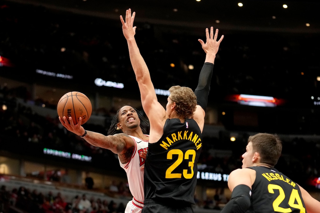 (Charles Rex Arbogast | AP) Chicago Bulls' DeMar DeRozan shoots around Utah Jazz's Lauri Markkanen as Walker Kessler watches during the first half of an NBA basketball game Monday, Nov. 6, 2023, in Chicago.