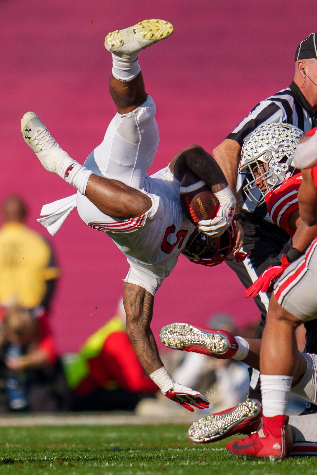 (Trent Nelson  |  The Salt Lake Tribune) Utah Utes running back TJ Pledger (5) flips during a run as the Utah Utes face the Ohio State Buckeyes at the Rose Bowl in Pasadena, Calif., on Saturday, Jan. 1, 2022.