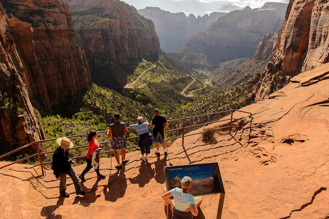 (Trent Nelson | The Salt Lake Tribune) In this May 5, 2015, photo hikers walk on the Canyon Overlook Trail in Zion National Park. More than 30,000 people crowded to Zion National Park in a single day over Memorial Day weekend as the iconic red-rock landscape at the already crowded park remains highly popular.