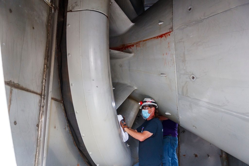 (Ting Shen | The New York Times) A technician does maintenance work on a Dominion Energy gas turbine in Remington, Va., on June 16, 2020. The industry remains deeply dependent on natural gas, a fossil fuel that emits greenhouse gases.