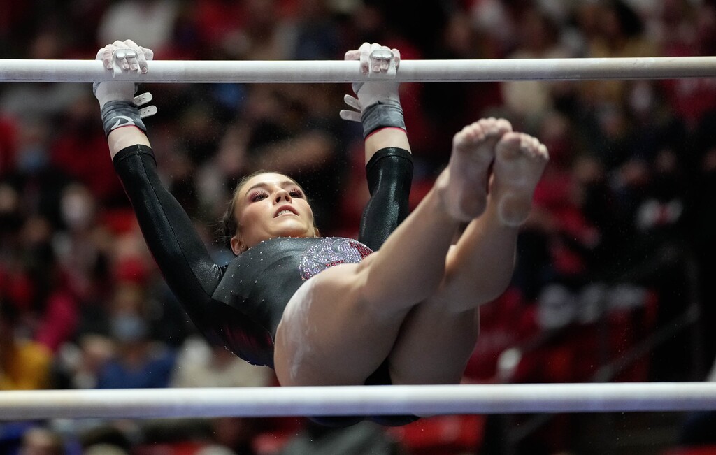 (Francisco Kjolseth | The Salt Lake Tribune) Utah’s Sage Thompson competes on the bars during their gymnastics meet with Stanford at the Huntsman Center in Salt Lake City, Saturday, Jan. 29, 2022.