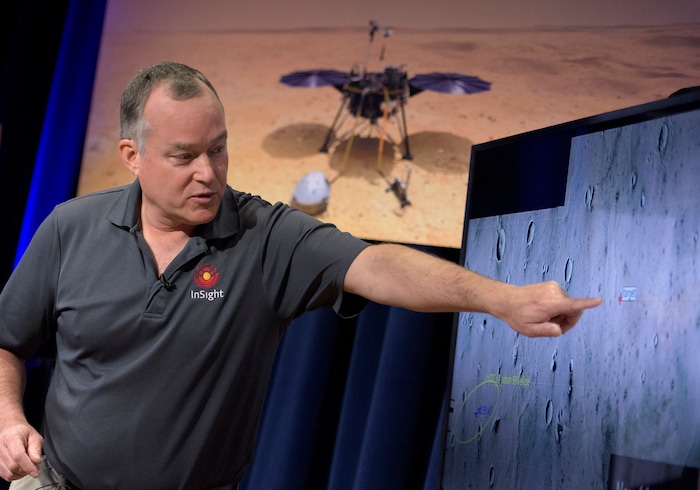(Bill Ingalls | NASA via The Associated Press) Tom Hoffman, InSight Project Manager, NASA JPL talks about the Mars InSight landing site during a pre-landing briefing, Sunday, Nov. 25, 2018 at NASA's Jet Propulsion Laboratory in Pasadena, Calif.  InSight, short for Interior Exploration using Seismic Investigations, Geodesy and Heat Transport, is a Mars lander designed to study the "inner space" of Mars: its crust, mantle, and core. InSight is scheduled to touch down on the Red Planet on Monday, Nov. 26.