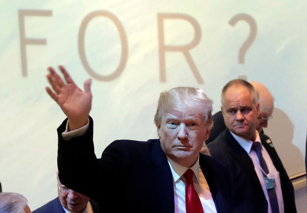 U.S. President Donald Trump arrives during the annual meeting of the World Economic Forum in Davos, Switzerland, Friday, Jan. 26, 2018. (AP Photo/Markus Schreiber)