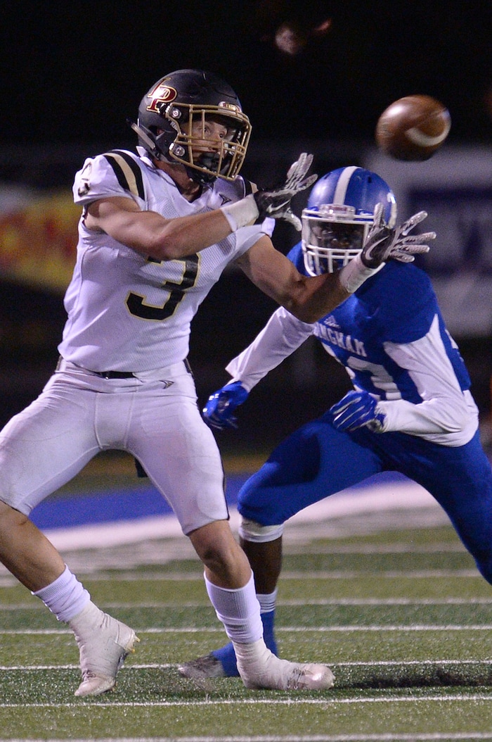 (Leah Hogsten | The Salt Lake Tribune) Lone Peak'sCody Collins pulls in the catch over Bingham's Marques Hamilton. Bingham High School defeated Lone Peak High School, 28-10 during their game Friday, September 28, 2017 in South Jordan.