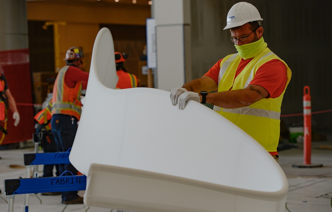 (Francisco Kjolseth  |  The Salt Lake Tribune) The area known as The Canyon begins to take shape with crews stretching fabric over metal fins to simulate southern Utah canyon walls during the first phase of construction of the Salt Lake City International Airport on Wednesday, May 20, 2020.
