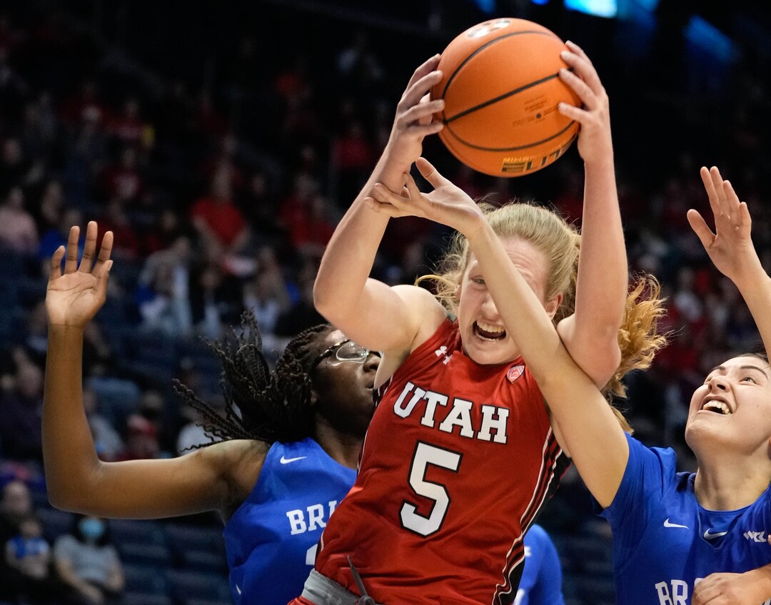 (Francisco Kjolseth | The Salt Lake Tribune) Utah Utes guard Gianna Kneepkens (5) pulls down a rebound in basketball action between the Utah Utes and the Brigham Young Cougars, at the Marriott Center in Provo, on Saturday, Dec. 10, 2022.