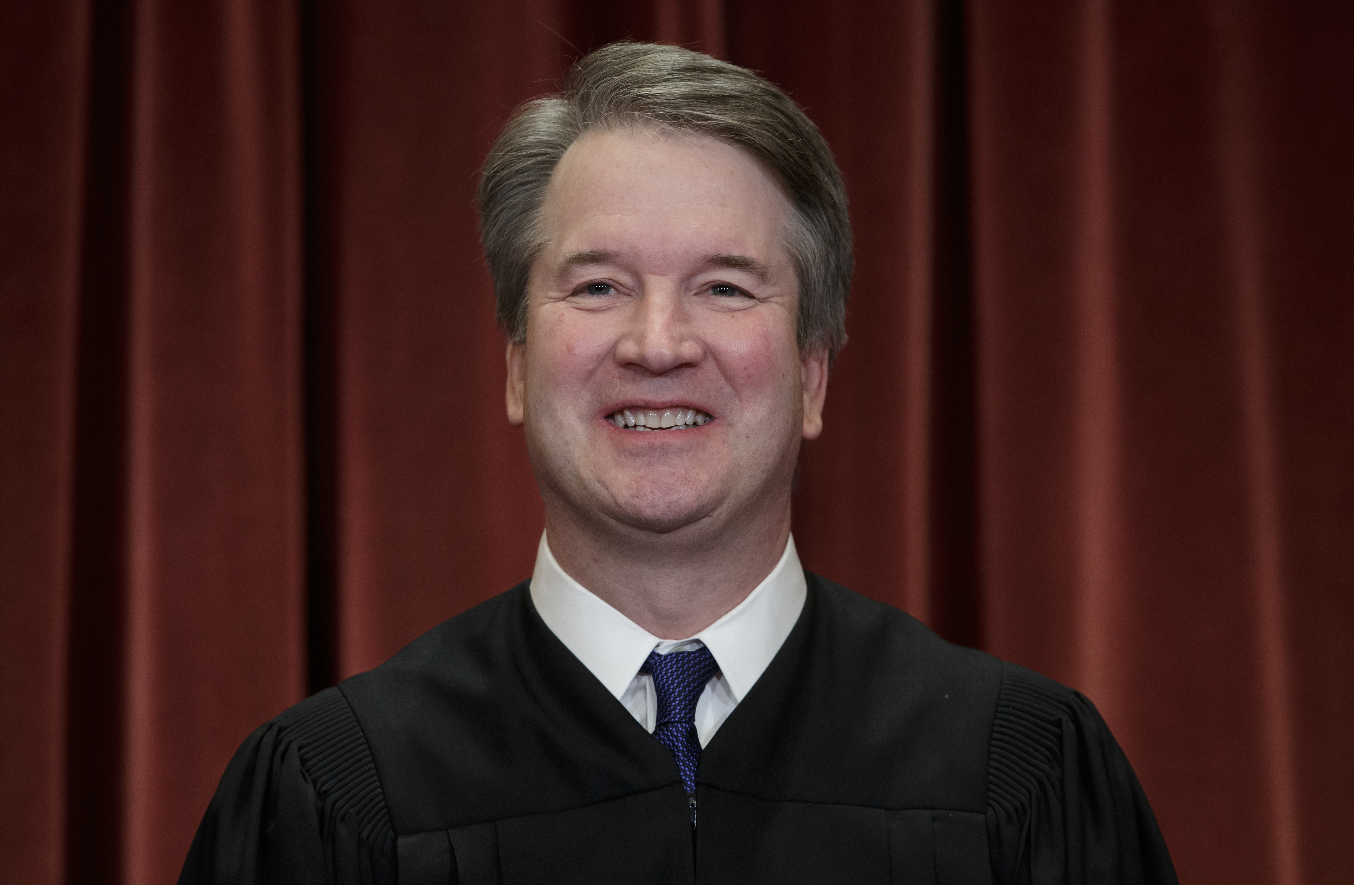 FILE - In this Nov. 30, 2018, file photo Associate Justice Brett Kavanaugh sits with fellow Supreme Court justices for a group portrait at the Supreme Court Building in Washington. A panel of judges has dismissed ethics complaints against Kavanaugh. The judges say the complaints must be dismissed because they were filed under a federal law that does not apply to Supreme Court justices. (AP Photo/J. Scott Applewhite, File)