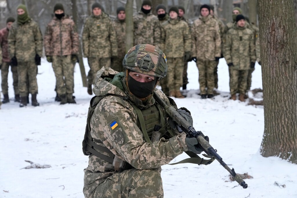 (Efrem Lukatsky | AP) An instructor trains members of Ukraine's Territorial Defense Forces, volunteer military units of the Armed Forces, in a city park in Kyiv, Ukraine, Saturday, Jan. 22, 2022. Dozens of civilians have been joining Ukraine's army reserves in recent weeks amid fears about Russian invasion.