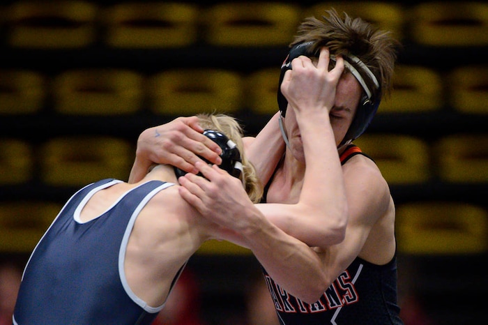 (Trent Nelson | The Salt Lake Tribune)  Murray's Thor Riches, right, and Olympus's Soyer Haaga, 5A State Championships, high school wrestling quarterfinals in Orem, Wednesday February 7, 2018.