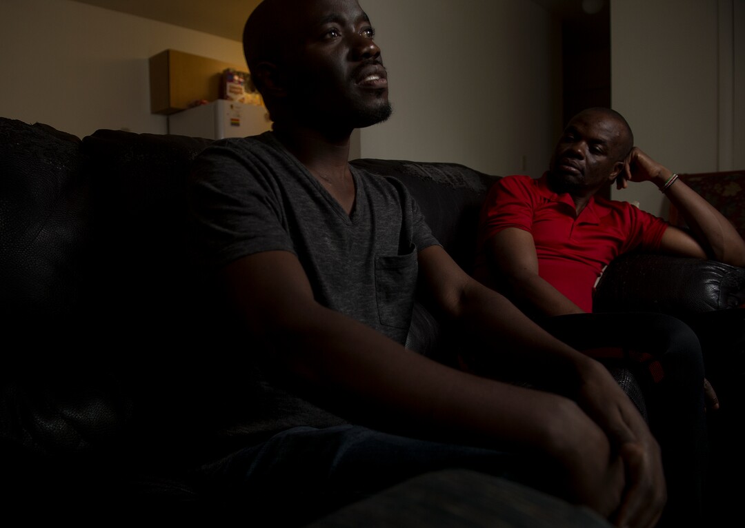 (Leah Hogsten  |  The Salt Lake Tribune) l-r In their native Uganda, a place where being gay can send you to prison, Barnabas Wobiliya and Apollo Kimuli risked their lives as advocates for AIDS education and equality for the LGBTQ community. Threatened with death, both men fled and spent a year in refugee camps before resettlement in Utah. The two are now trying to build their lives here, while using the Internet to continue their activism for others in Africa's LGBTQ community.