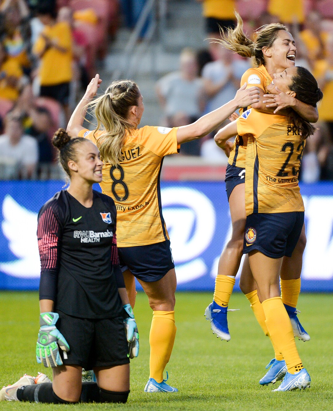 (Leah Hogsten  |  The Salt Lake Tribune) Utah Royals FC midfielder Lo'eau LaBonta (9) and Utah Royals FC forward Amy Rodriguez (8) run to Utah Royals FC forward Christen Press (23) to celebrate her first goal as Sky Blue FC goalkeeper Kailen Sheridan (1) reacts to Press' first goal as the Utah Royals FC host Sky Blue FC, August 7, 2019 at Rio Tinto Stadium.