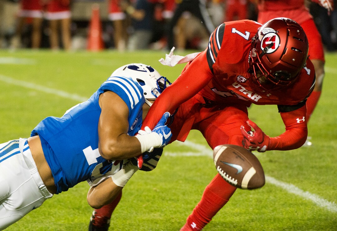 (Rick Egan  |  The Salt Lake Tribune) Utah Utes defensive back Jaylon Johnson (7) breaks up a pass intended for Brigham Young Cougars wide receiver Aleva Hifo (15), in football action BYU vs Utah, at Lavell Edwards Stadium in Provo, Saturday, September 9, 2017.