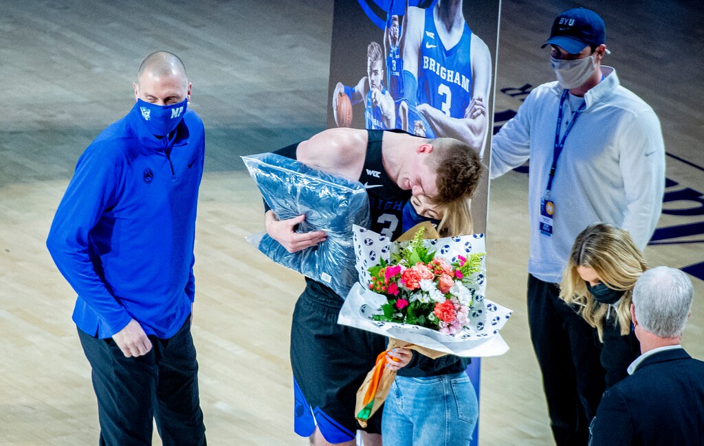(Isaac Hale | Special to The Tribune) Brigham Young University forward Matt Haarms (3) hugs his girlfriend as he is honored with other graduating seniors before a game between the BYU Cougars and the Saint Mary’s College of California Gaels held at the Marriott Center in Provo on Saturday, Feb. 27, 2021.