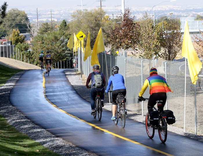(Al Hartmann  |  The Salt Lake Tribune) 	Bike riders take their first tour down a long section of Parley’s Trail from Tanner Park towards Sugarhouse Park Tuesday Oct. 17. The trail stays above and parallels I-80 and uses bridges to get to Sugarhouse Park. Made possible by the 2012 Parks and Trails bond initiative, completion of these phases means eight miles of the trail is now complete from the Bonneville Shoreline to 900 West. 