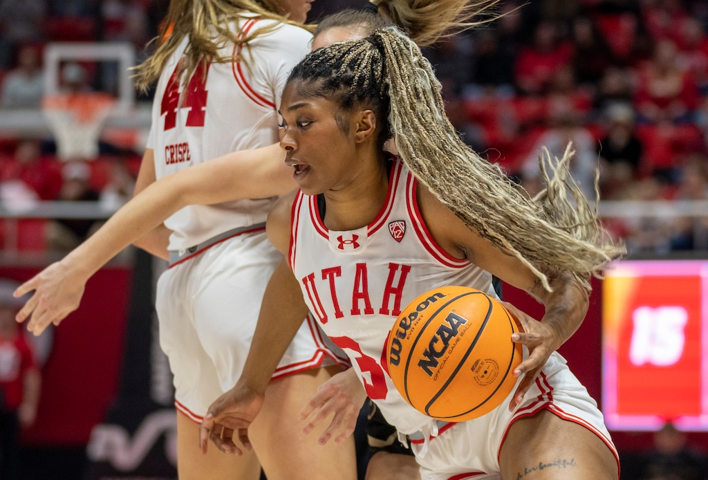 (Rick Egan | The Salt Lake Tribune)  Utah Utes forward Dasia Young (34) takes the ball inside, in basketball action at the Jon M. Huntsman Center, on Friday, Feb. 16, 2024.