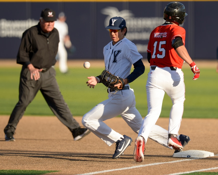 (Leah Hogsten  |  The Salt Lake Tribune) BYU's Brian Hsu, pictured here with Utah's Erick Migueles, is one of the few returning starters on the Cougars' 2019 baseball team.