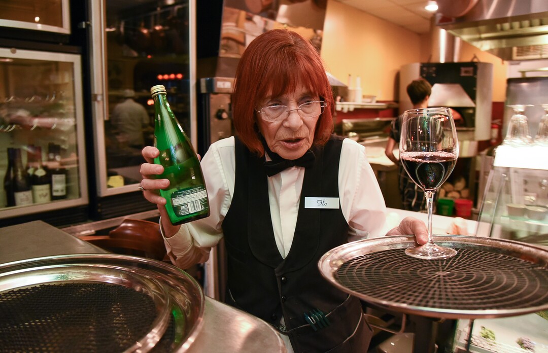 (Francisco Kjolseth  |  The Salt Lake Tribune)  Flo Blank, who has been a restaurant server for nearly 40 years, previously working in NYC, and at Salt Lake City's La Parisian and Al Forno's, works her regular shift at The Paris Restaurant at 15th and 15th in Salt Lake City recently as she keeps a quick pace and can be heard regularly saying "ooh, la, la and forget about it."