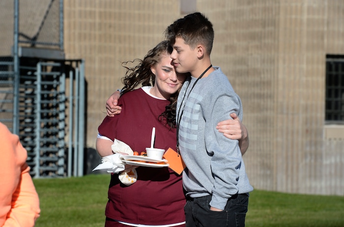 (Scott Sommerdorf   |  The Salt Lake Tribune)   Inmate Dianna Robles has a quiet moment with her 14 year old son Demitrie during "Kids Day" at the Utah State Prison, Saturday, October 7, 2017. 