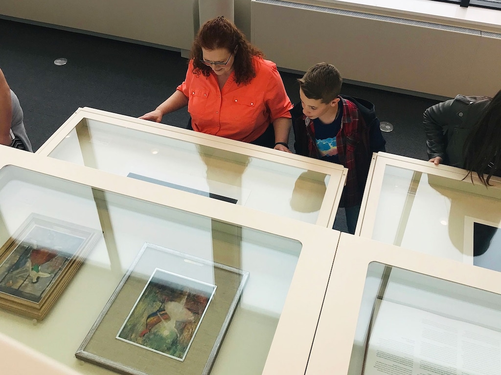 (Selina Christensen  |  Nora Eccles Harrison Museum of Art) During a visit to the Nora Eccles Harrison Museum of Art at Utah State University, students explore art in the drawers of the Object Study Center.