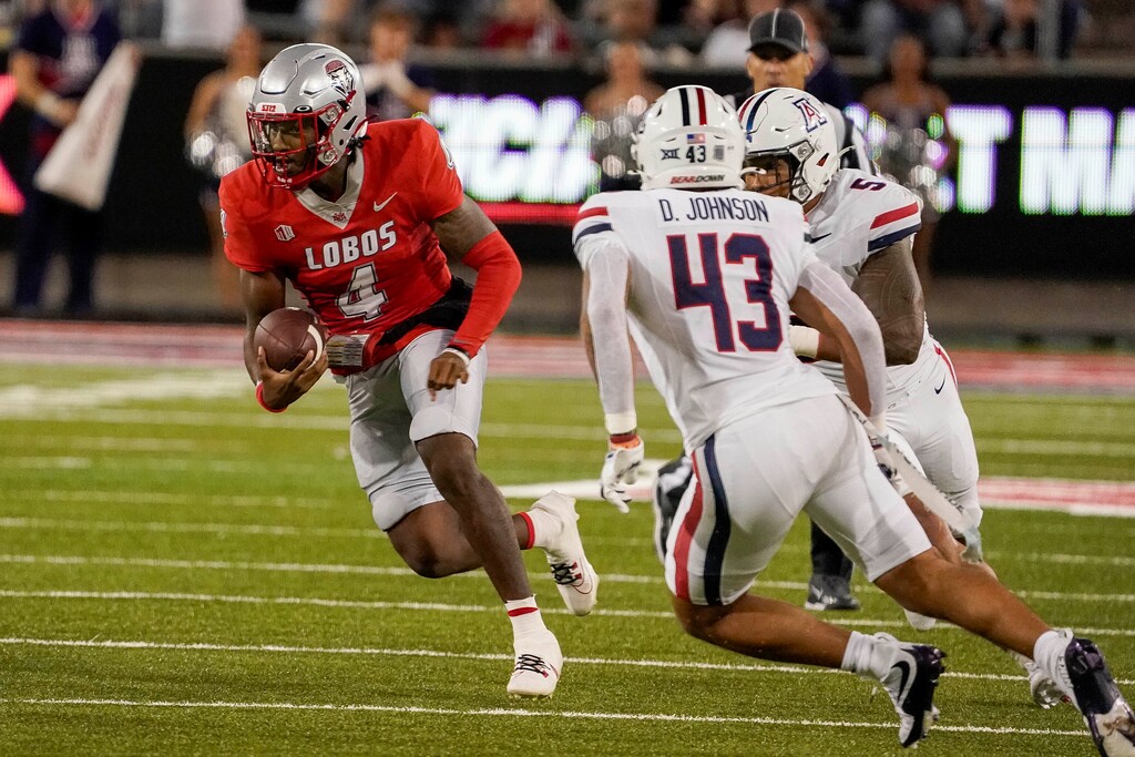 New Mexico Lobos quarterback Devon Dampier (4) during the first half of an NCAA college football game against Arizona Saturday, Aug. 31, 2024, in Tucson, Ariz. (AP Photo/Darryl Webb)