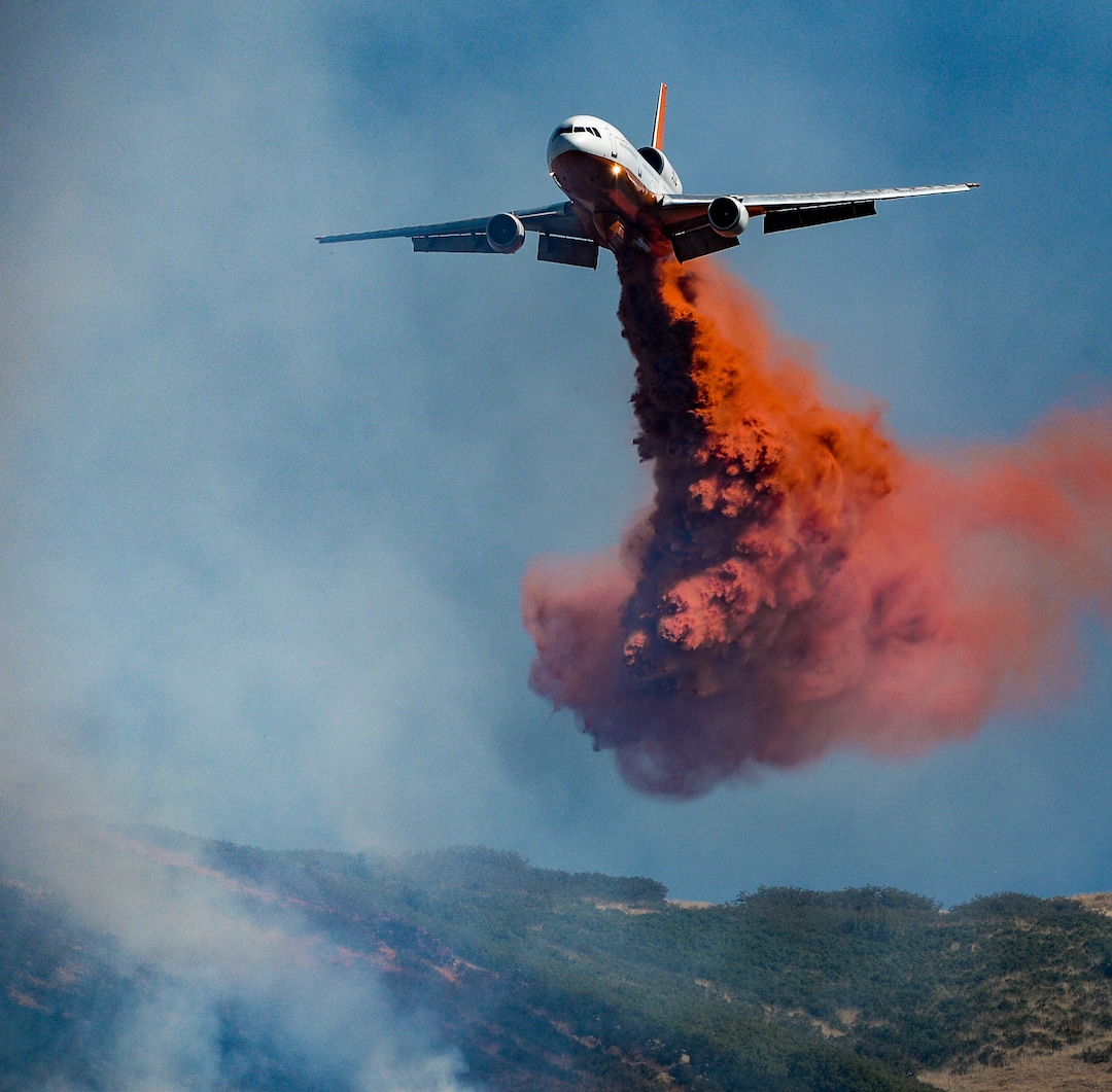 (Francisco Kjolseth  |  The Salt Lake Tribune)  Fire Crews direct a slurry bomber to unload its payload along the East Bountiful bench that grew to 150 acres early Friday morning, Aug. 30, 2019, and destroyed three homes. On Sept. 2, officials said the fire was 100% contained.