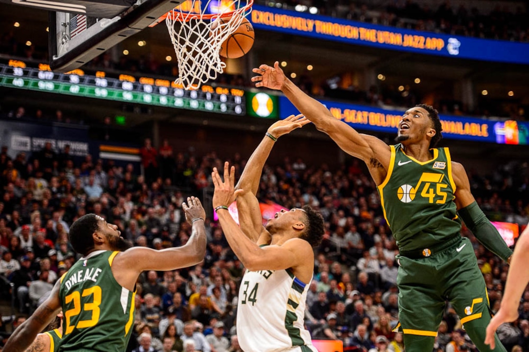 (Trent Nelson | The Salt Lake Tribune)  Utah Jazz guard Donovan Mitchell (45) blocks a shot by Milwaukee Bucks forward Giannis Antetokounmpo (34) as the Utah Jazz host the Milwaukee Bucks, NBA basketball in Salt Lake City on Saturday March 2, 2019.