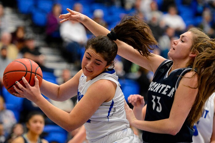(Trent Nelson | The Salt Lake Tribune)  Fremont's Abby Broadbent (12) and Hunter's Elyse Farley (33) as Hunter faces Fremont in the 6A High School Girls' Basketball Tournament at SLCC in Taylorsville, Tuesday Feb. 20, 2018.
