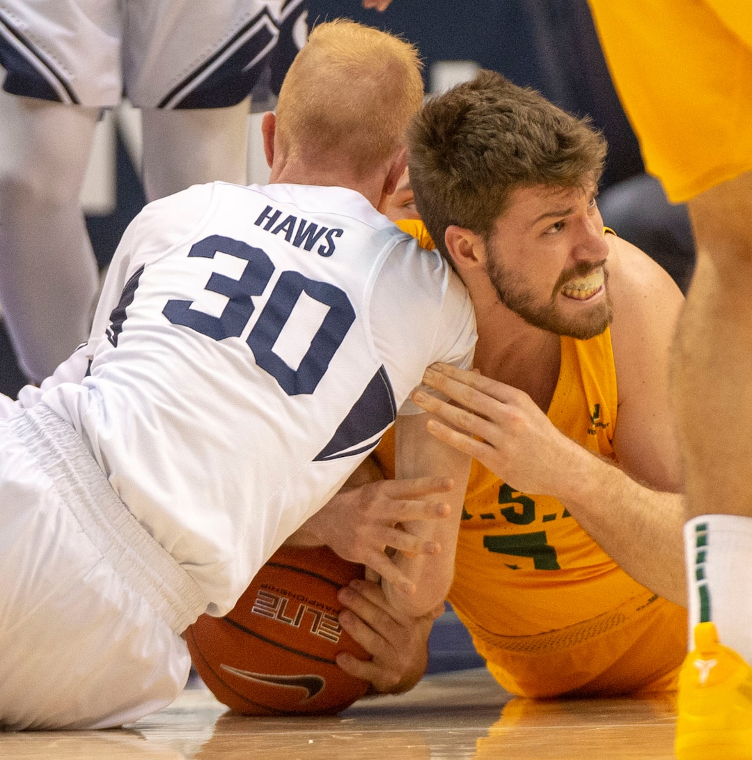 (Rick Egan  |  The Salt Lake Tribune)      Brigham Young Cougars guard TJ Haws (30) goes for a loose ball along with San Francisco Dons center Jimbo Lull (5), in WCC basketball action at the Marriott Center, Thursday, February 21, 2018.
