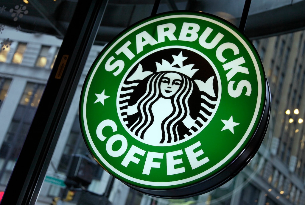 FILE - This Dec. 20, 2010, file photo, shows signage at a Starbucks store in New York. Starbucks is launching voice ordering though its iPhone app. Starting Monday, Jan. 30, 2017, anyone with a device that has an Amazon device with Alexa, like the Echo smart speaker, is able to place a Starbucks order by just using their voice. Starbucks is also launching a beta test of voice ordering through its iPhone app. The Seattle-based coffee giant says the feature is being rolled out to a limited group of 1,000 people nationwide Monday. (AP Photo/Richard Drew, File)