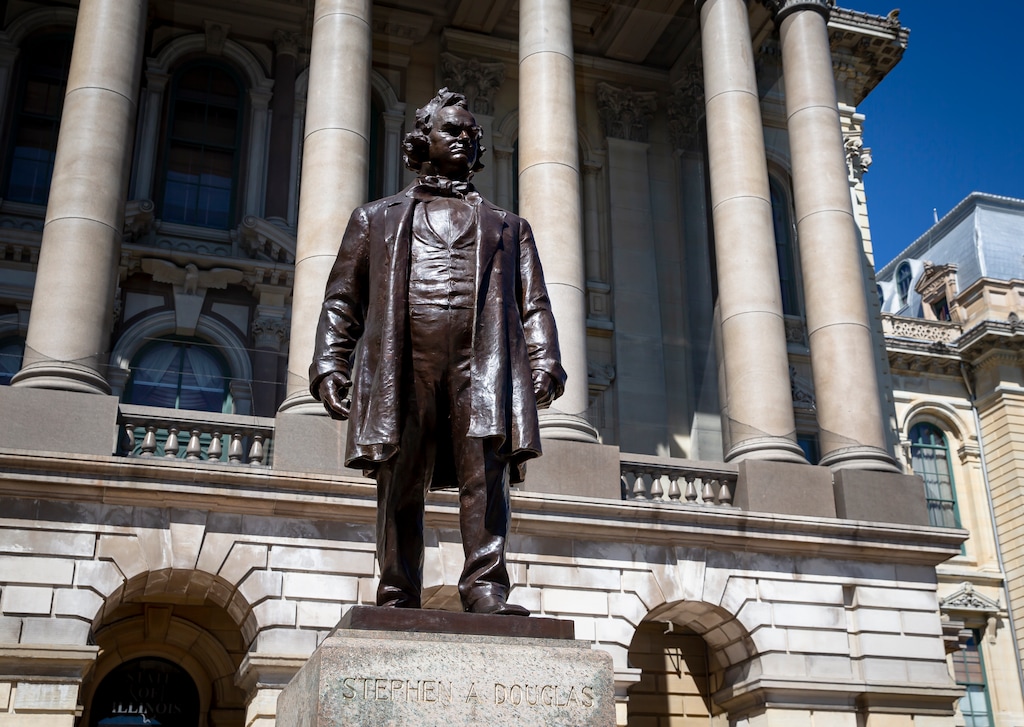A statue of Stephen Douglas stands in front of the east entrance to the Illinois State Capitol, Wednesday, Aug. 19, 2020, in Springfield, Ill. Illinois officials approved Wednesday the removal of the statue of the 19th century senator from Illinois who owned slaves and espoused the notion that each territory should decide whether slavery would be allowed. (Justin L. Fowler/The State Journal-Register via AP)