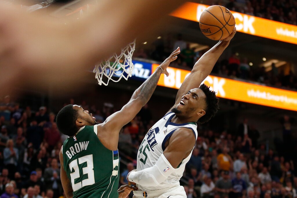 (Rick Bowmer  |  AP file photo) Utah Jazz guard Donovan Mitchell (45) dunks on Milwaukee Bucks guard Sterling Brown (23) during the first half on Friday, Nov. 8, 2019. Donovan dunks, it turns out, are the No. 1 driver of traffic to utahjazz.com.