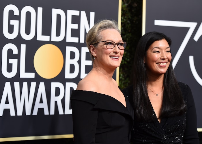 Meryl Streep, left, and Ai-jen Poo arrive at the 75th annual Golden Globe Awards at the Beverly Hilton Hotel on Sunday, Jan. 7, 2018, in Beverly Hills, Calif. (Photo by Jordan Strauss/Invision/AP)